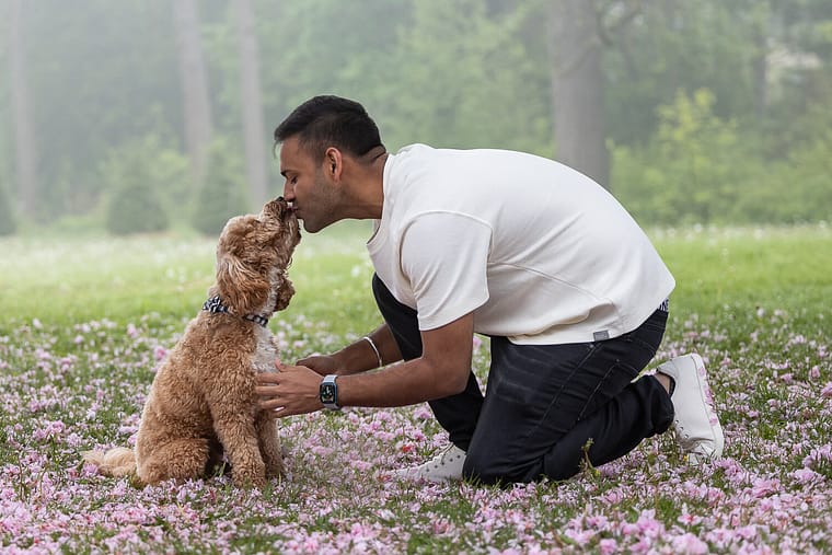 dog dad kissing his dog during a pet photo shoot in Oakville