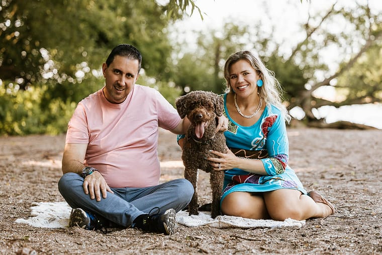dog and family posing during a pet and family photo session.