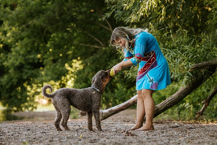 dog mom playing with the dog in Grimsby.